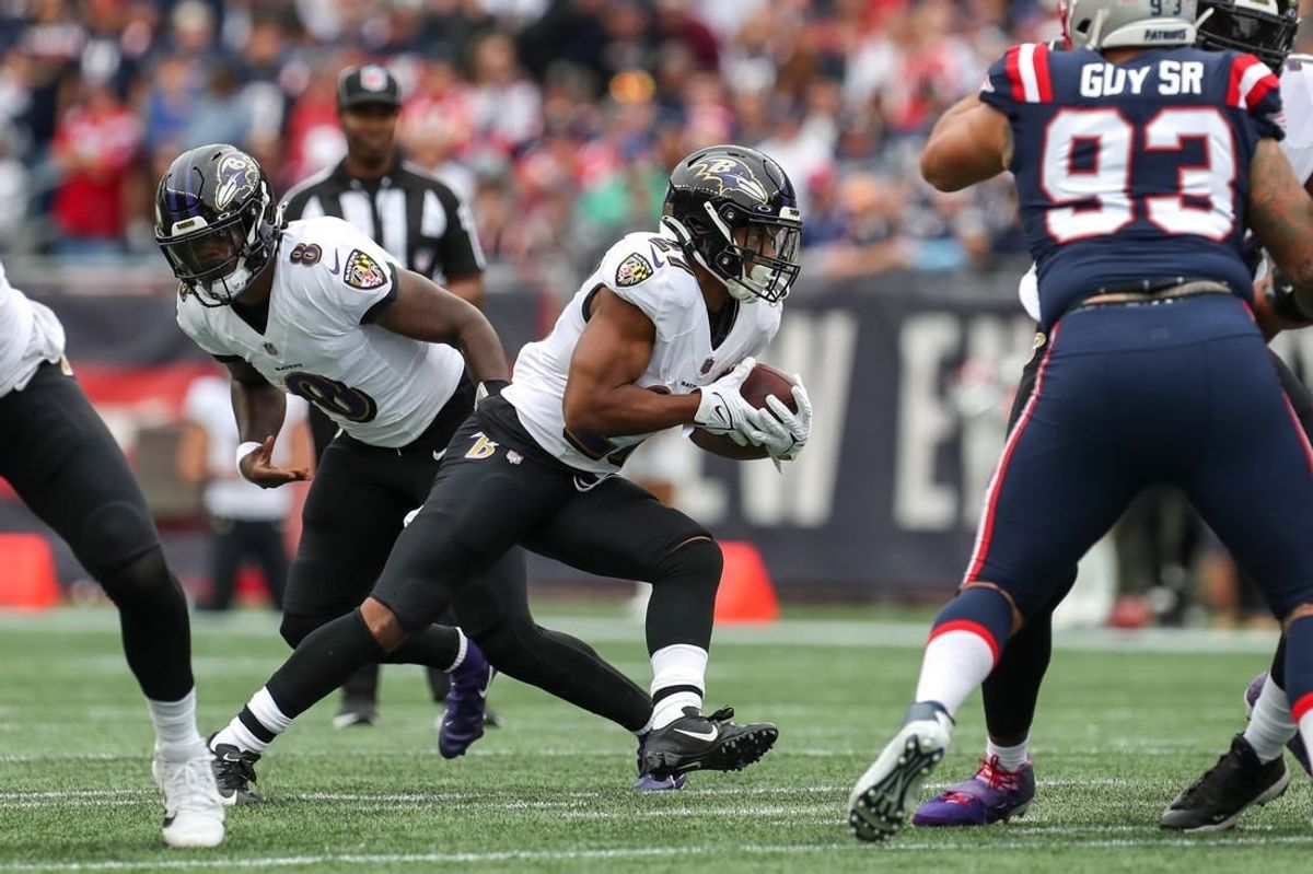 Sep 25, 2022; Foxborough, Massachusetts, USA; Baltimore Ravens running back JK Dobbins (27) runs the ball during the first half against the New England Patriots at Gillette Stadium.
