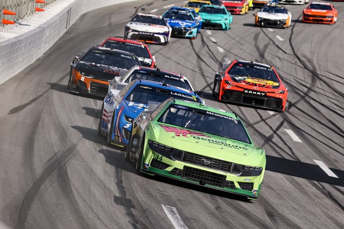 Feb 25, 2024; Hampton, Georgia, USA; NASCAR Cup Series driver Michael McDowell (34) battles with NASCAR Cup Series driver Kyle Larson (5) during the Ambetter Health 400 at Atlanta Motor Speedway.