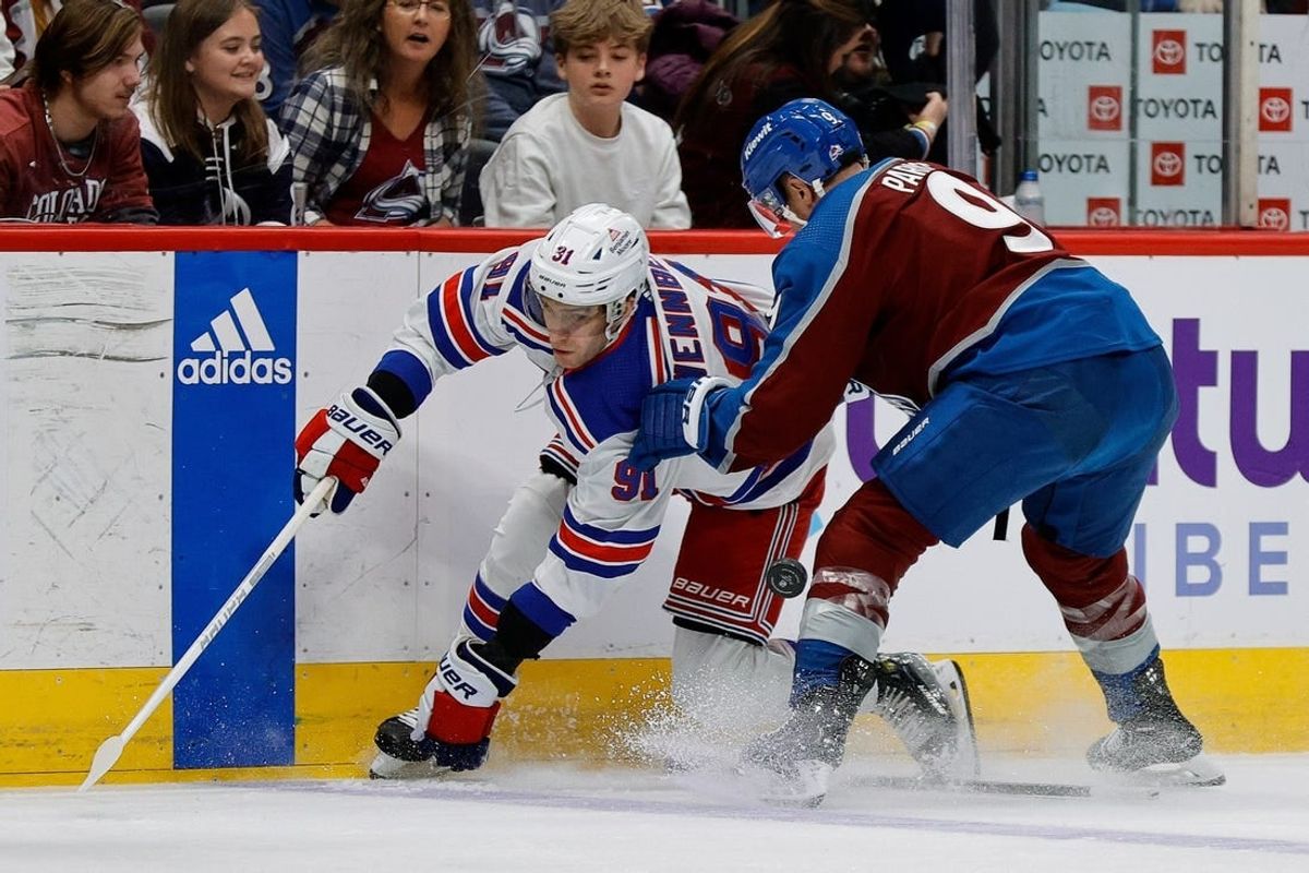 Mar 28, 2024; Denver, Colorado, USA; New York Rangers center Alex Wennberg (91) and Colorado Avalanche left wing Zach Parise (9) battle for the puck in the first period at Ball Arena.