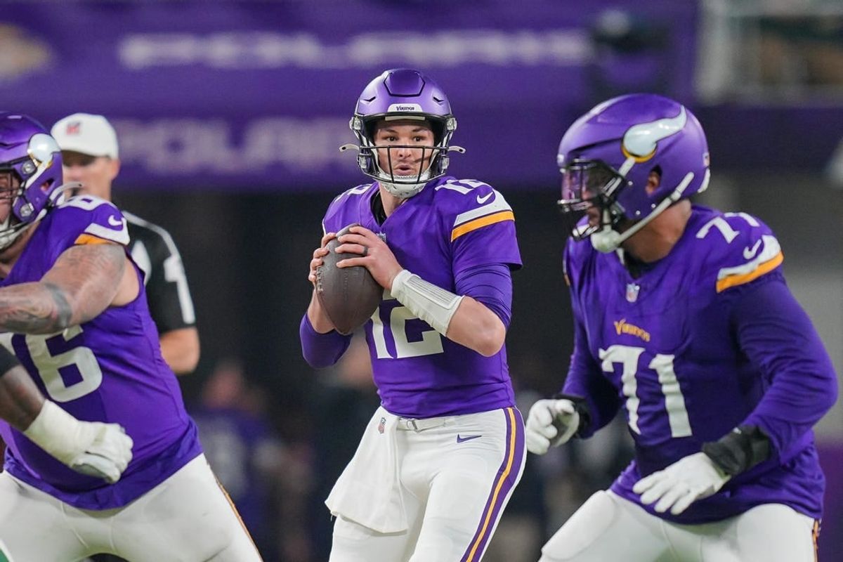 Dec 31, 2023; Minneapolis, Minnesota, USA; Minnesota Vikings quarterback Nick Mullens (12) drops back to pass against the Green Bay Packers in the third quarter at U.S. Bank Stadium.
