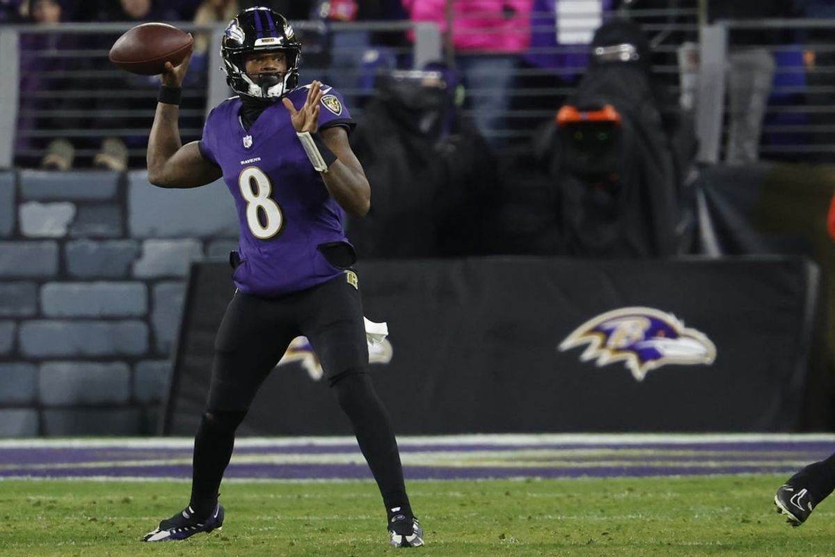 Jan 28, 2024; Baltimore, Maryland, USA; Baltimore Ravens quarterback Lamar Jackson (8) passes the ball against the Kansas City Chiefs in the AFC Championship football game at M&T Bank Stadium.