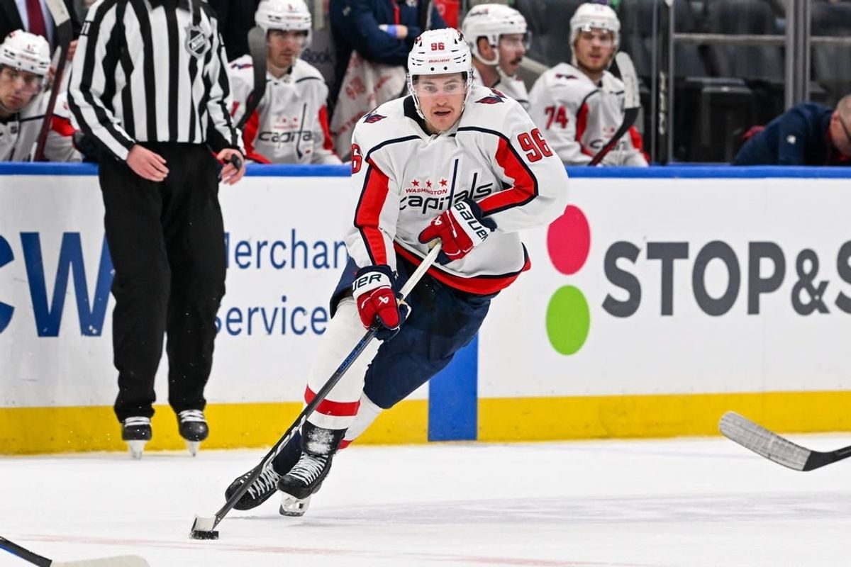 Dec 29, 2023; Elmont, New York, USA; Washington Capitals right wing Nicolas Aube-Kubel (96) skates with the puck against the New York Islanders during the third period at UBS Arena.