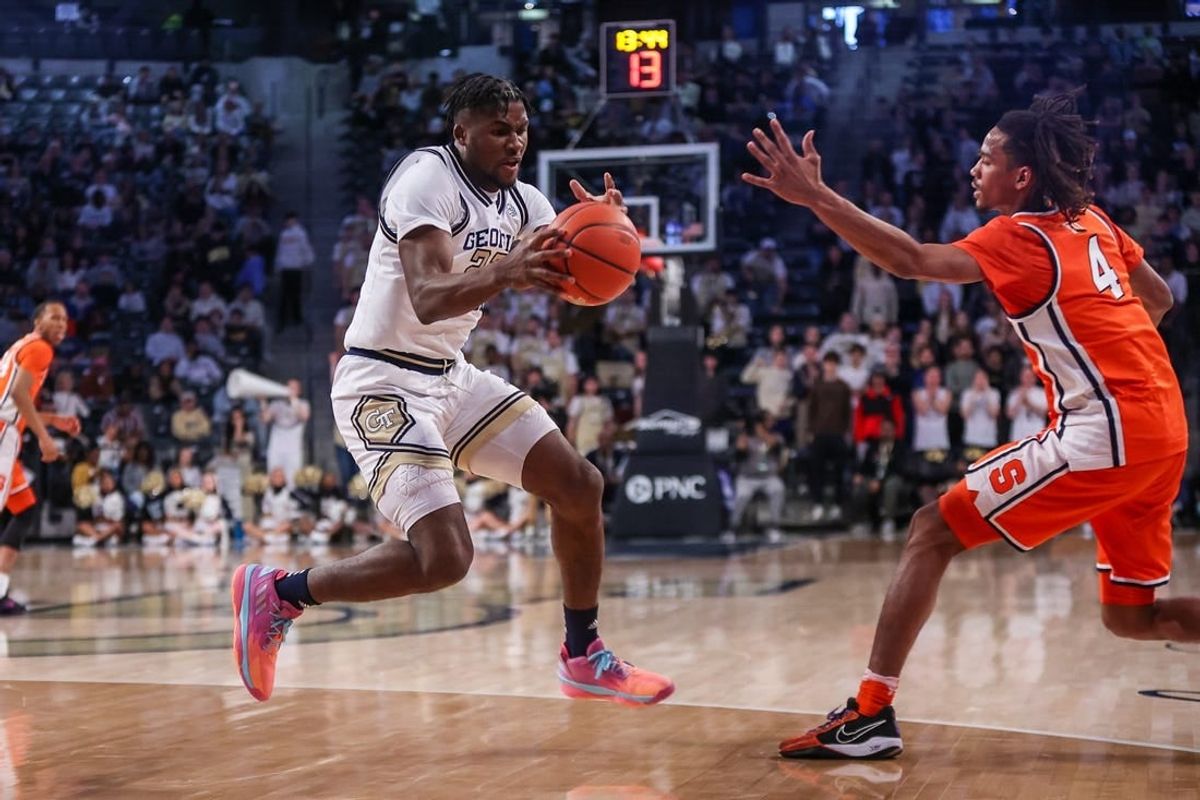 Feb 17, 2024; Atlanta, Georgia, USA; Georgia Tech Yellow Jackets forward Ibrahima Sacko (23) grabs the ball from Syracuse Orange forward Chris Bell (4) in the first half at McCamish Pavilion.