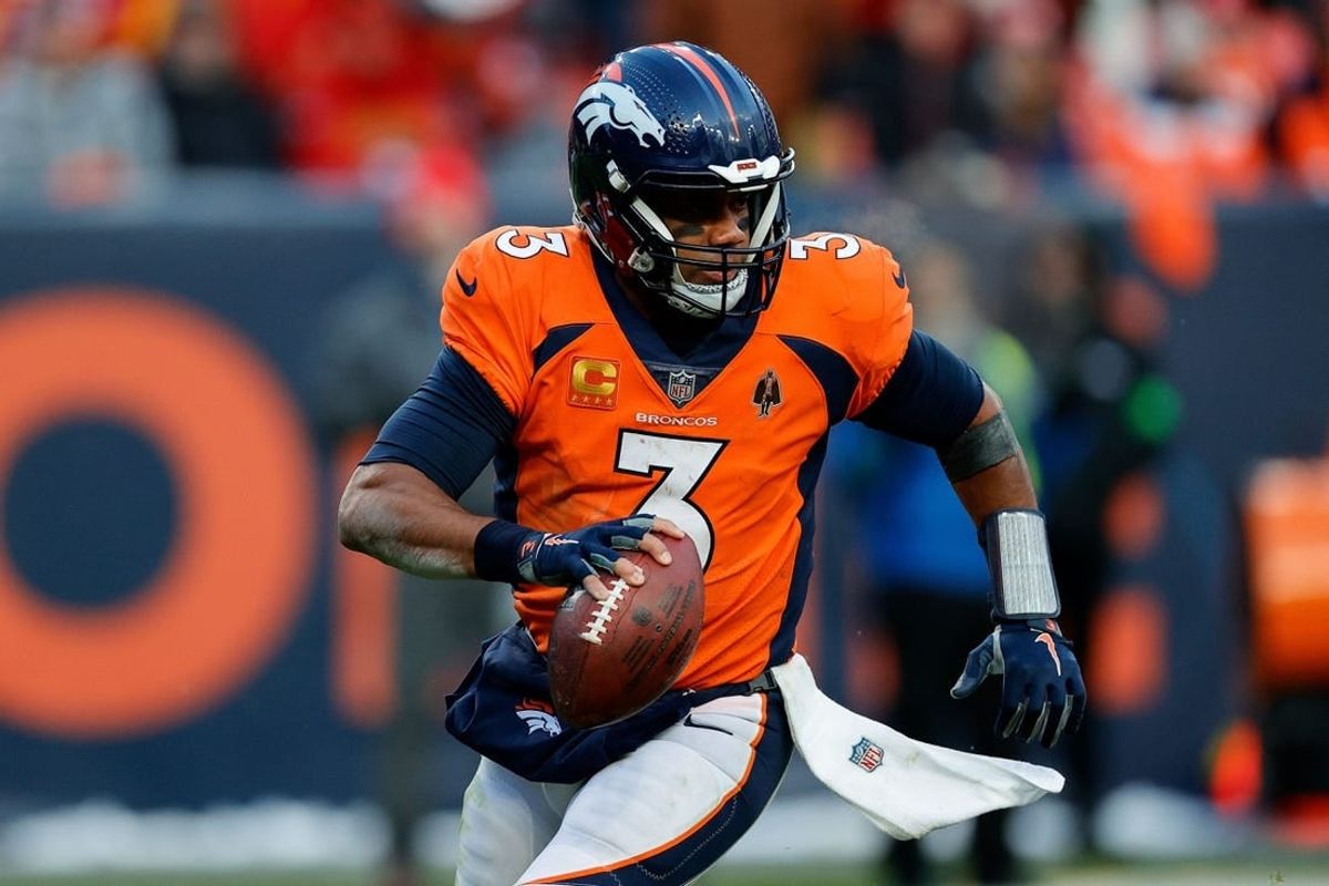 Oct 29, 2023; Denver, Colorado, USA; Denver Broncos quarterback Russell Wilson (3) scrambles in the fourth quarter against the Kansas City Chiefs at Empower Field at Mile High.