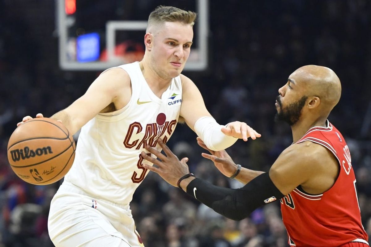 Jan 15, 2024; Cleveland, Ohio, USA; Cleveland Cavaliers guard Sam Merrill (5) dribbles beside Chicago Bulls guard Jevon Carter (5) in the second quarter at Rocket Mortgage FieldHouse.