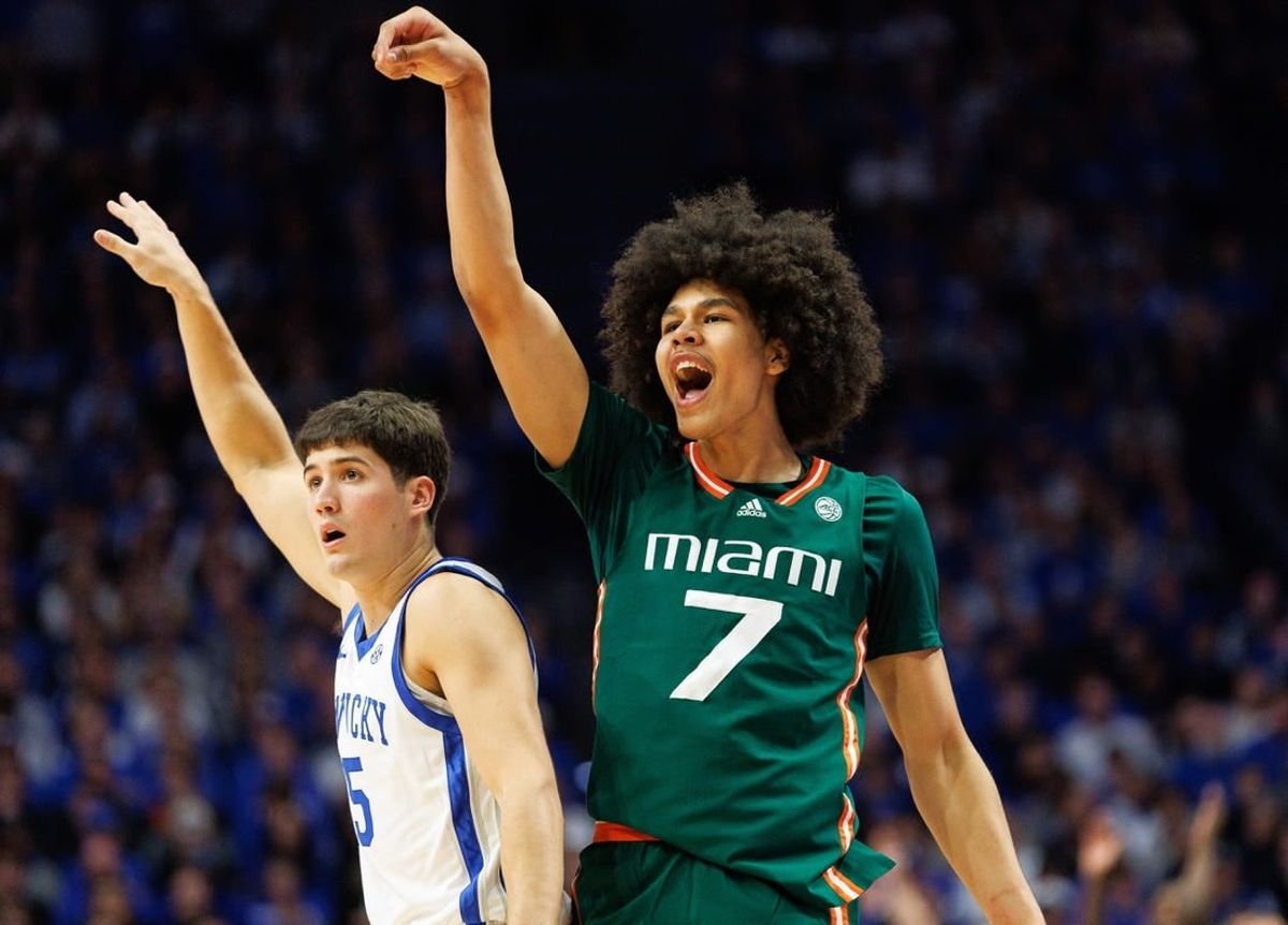 Nov 28, 2023; Lexington, Kentucky, USA; Miami (Fl) Hurricanes guard Kyshawn George (7) reacts after making a basket during the first half against the Kentucky Wildcats at Rupp Arena at Central Bank Center.
