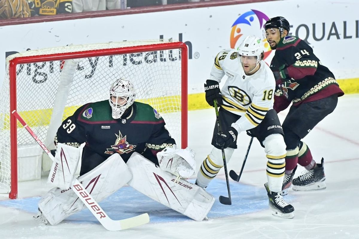 Jan 9, 2024; Tempe, Arizona, USA; Arizona Coyotes goaltender Connor Ingram (39) and defenseman Matt Dumba (24) defend against Boston Bruins center Pavel Zacha (18) in the first period at Mullett Arena.