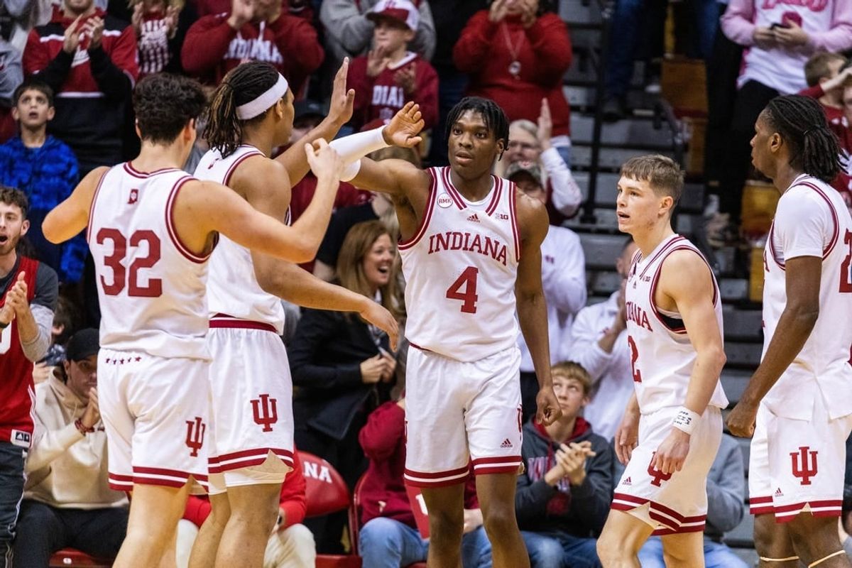 Dec 19, 2023; Bloomington, Indiana, USA; Indiana Hoosiers forward Anthony Walker (4) celebrates a basket and foul with teammates in the second half against the Morehead State Eagles at Simon Skjodt Assembly Hall.