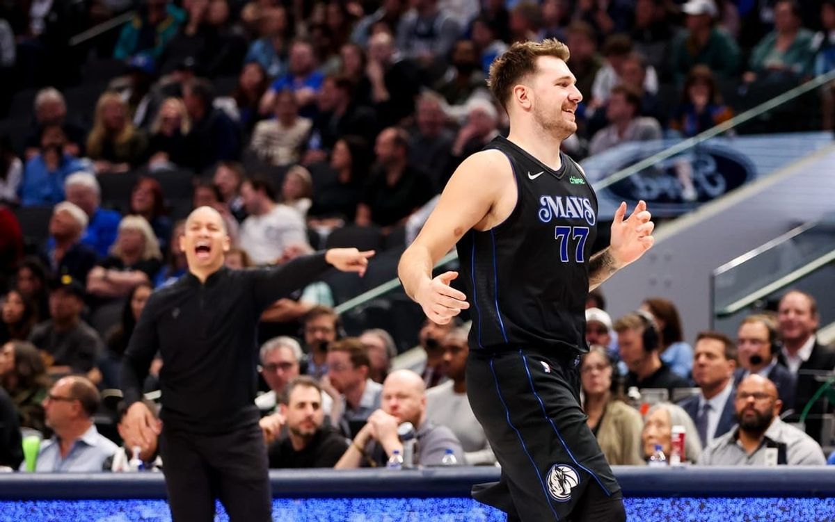 Nov 10, 2023; Dallas, Texas, USA;  Dallas Mavericks guard Luka Doncic (77) reacts in front of LA Clippers head coach Tyronn Lue during the second half at American Airlines Center.