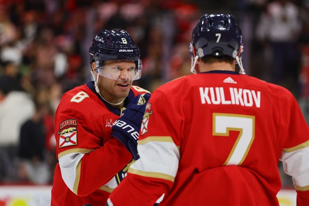 Apr 11, 2024; Sunrise, Florida, USA; Florida Panthers right wing Kyle Okposo (8) talks to defenseman Dmitry Kulikov (7) during the second period at Amerant Bank Arena.