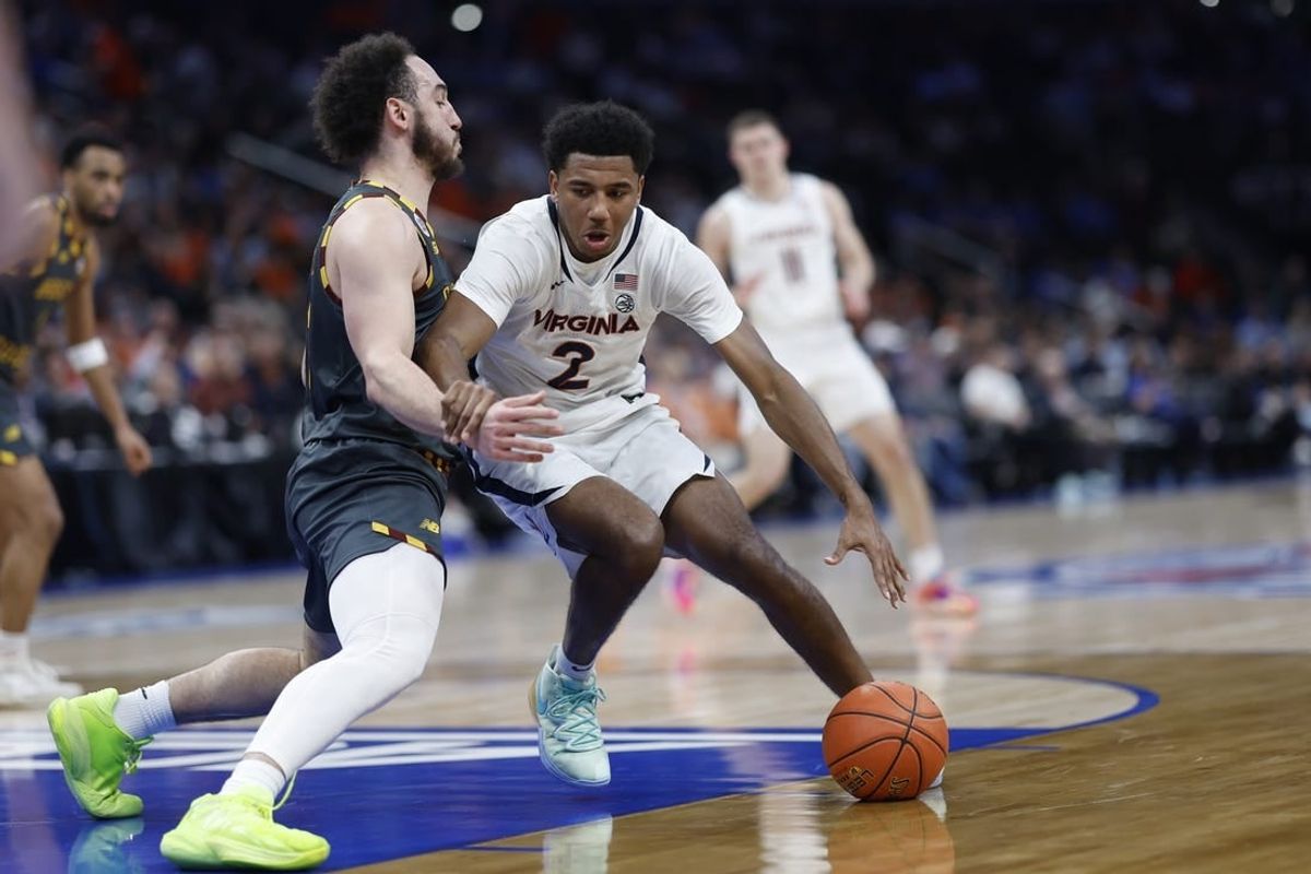 Mar 14, 2024; Washington, D.C., USA; Virginia Cavaliers guard Reece Beekman (2) drives to the basket as Boston College Eagles guard Jaeden Zackery (3) defends in the first half at Capital One Arena.