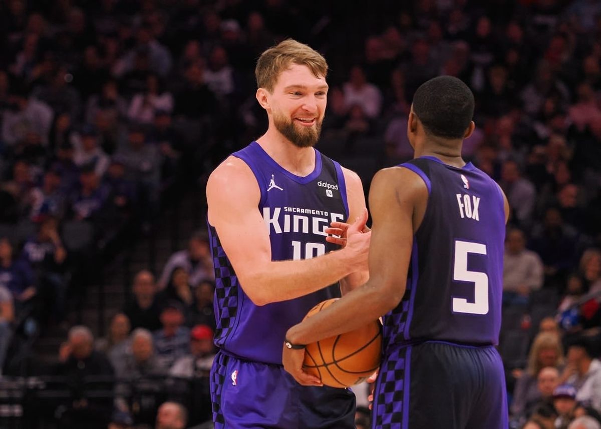 Feb 9, 2024; Sacramento, California, USA; Sacramento Kings center Domantas Sabonis (10) smiles with guard De'Aaron Fox (5) after a play against the Denver Nuggets during the second quarter at Golden 1 Center.