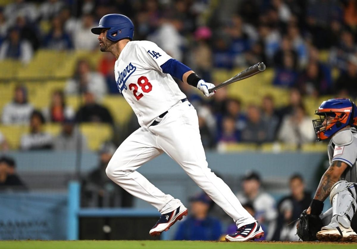 J.D. Martinez (28) singles in a run in the eighth inning against the New York Mets at Dodger Stadium.
