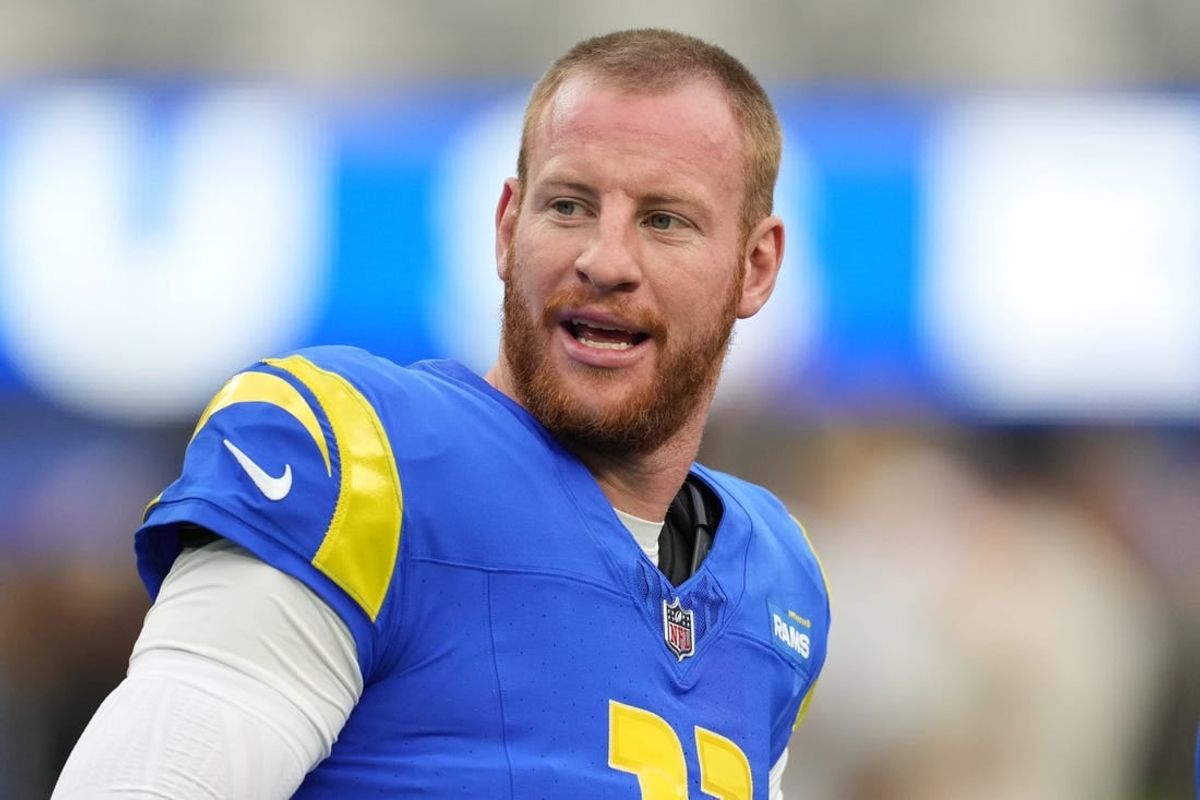Dec 17, 2023; Inglewood, California, USA; Los Angeles Rams quarterback Carson Wentz (11) reacts during the first half against the Washington Commanders at SoFi Stadium.