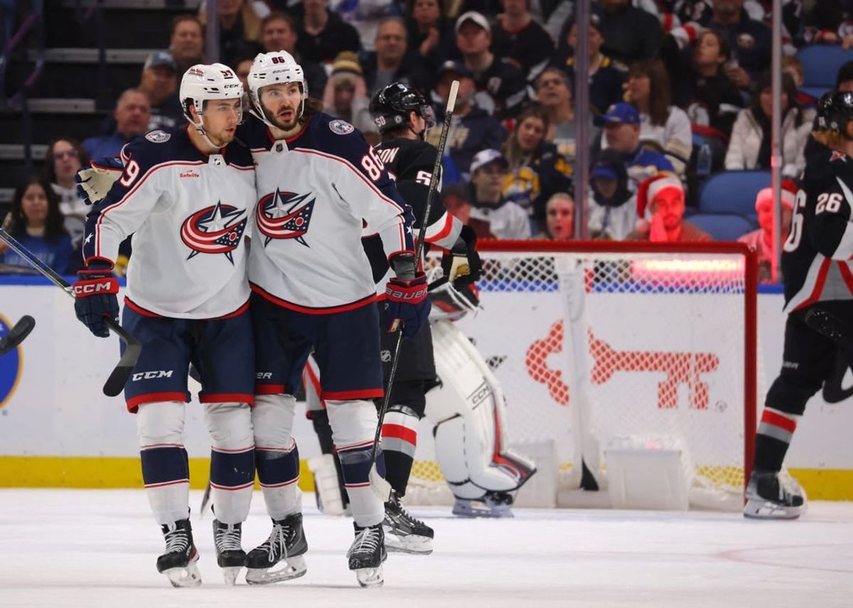 Dec 19, 2023; Buffalo, New York, USA;  Columbus Blue Jackets right wing Kirill Marchenko (86) celebrates his goal with teammates during the second period against the Buffalo Sabres at KeyBank Center.