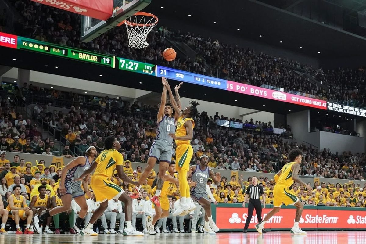 Jan 27, 2024; Waco, Texas, USA; TCU Horned Frogs guard Micah Peavy (0) shoots over Baylor Bears guard Ja'Kobe Walter (4) during the first half at Paul and Alejandra Foster Pavilion.