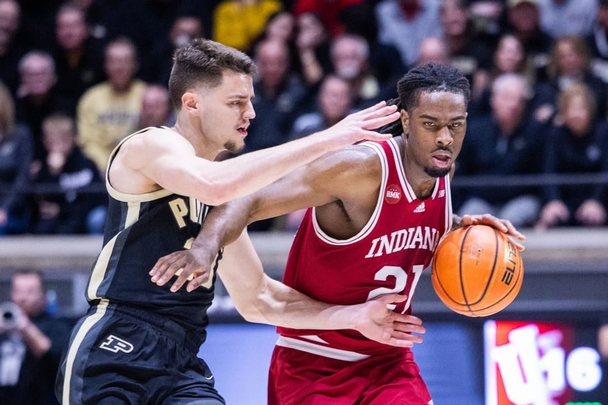 Feb 10, 2024; West Lafayette, Indiana, USA; (Editors Notes: Caption Correction) Indiana Hoosiers forward Mackenzie Mgbako (21) dribbles the ball while Purdue Boilermakers forward Camden Heide (23) defends in the first half at Mackey Arena.