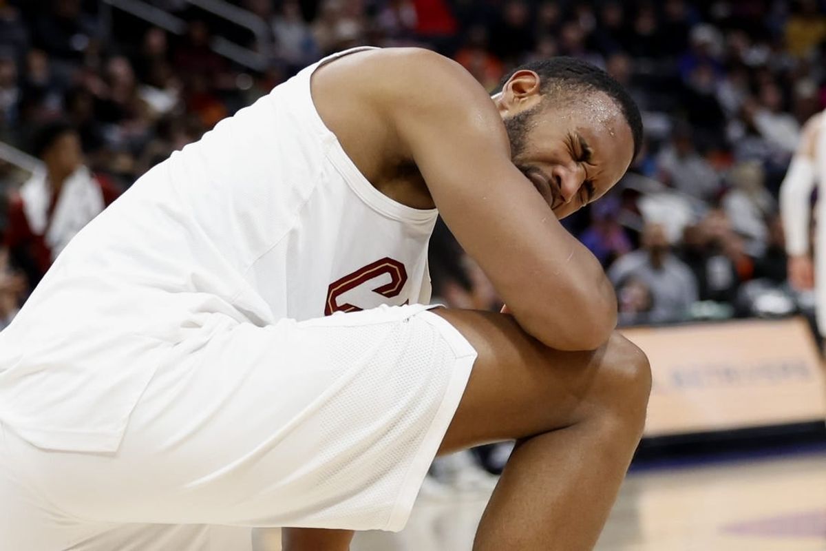 Mar 1, 2024; Detroit, Michigan, USA;  Cleveland Cavaliers forward Evan Mobley (4) reacts after he is poked in the eye in the first half against the Detroit Pistons at Little Caesars Arena.