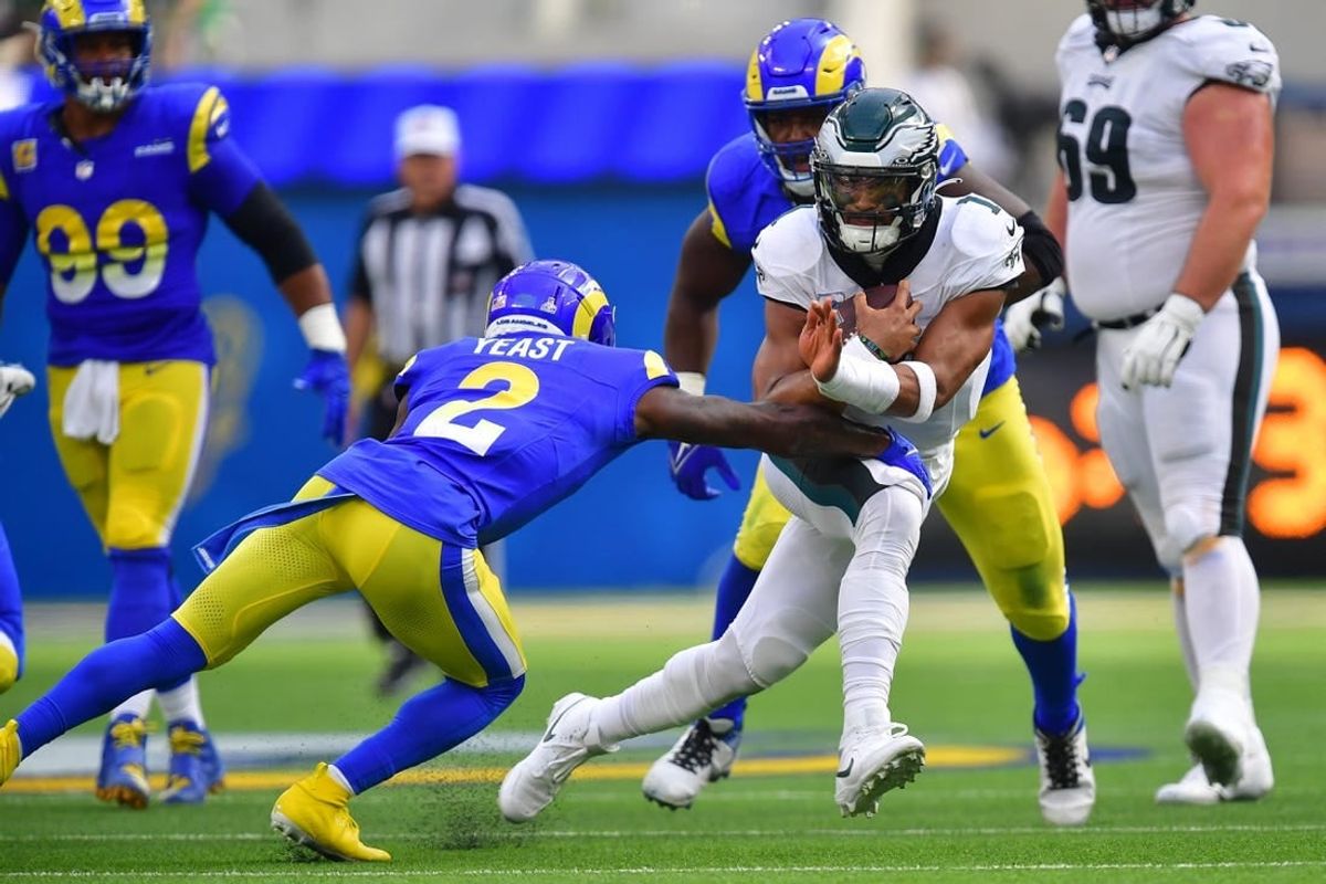 Oct 8, 2023; Inglewood, California, USA; Philadelphia Eagles quarterback Jalen Hurts (1) runs the ball against Los Angeles Rams safety Russ Yeast (2) during the first half at SoFi Stadium.