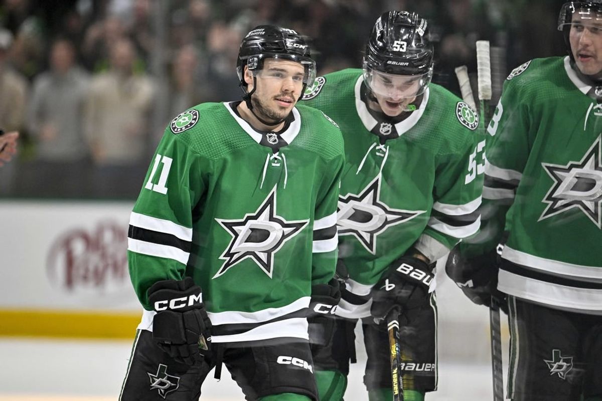 Feb 26, 2024; Dallas, Texas, USA; Dallas Stars center Logan Stankoven (11) and center Wyatt Johnston (53) skates off the ice after Stankoven scores his first career NHL goal during the second period against the New York Islanders at the American Airlines Center.