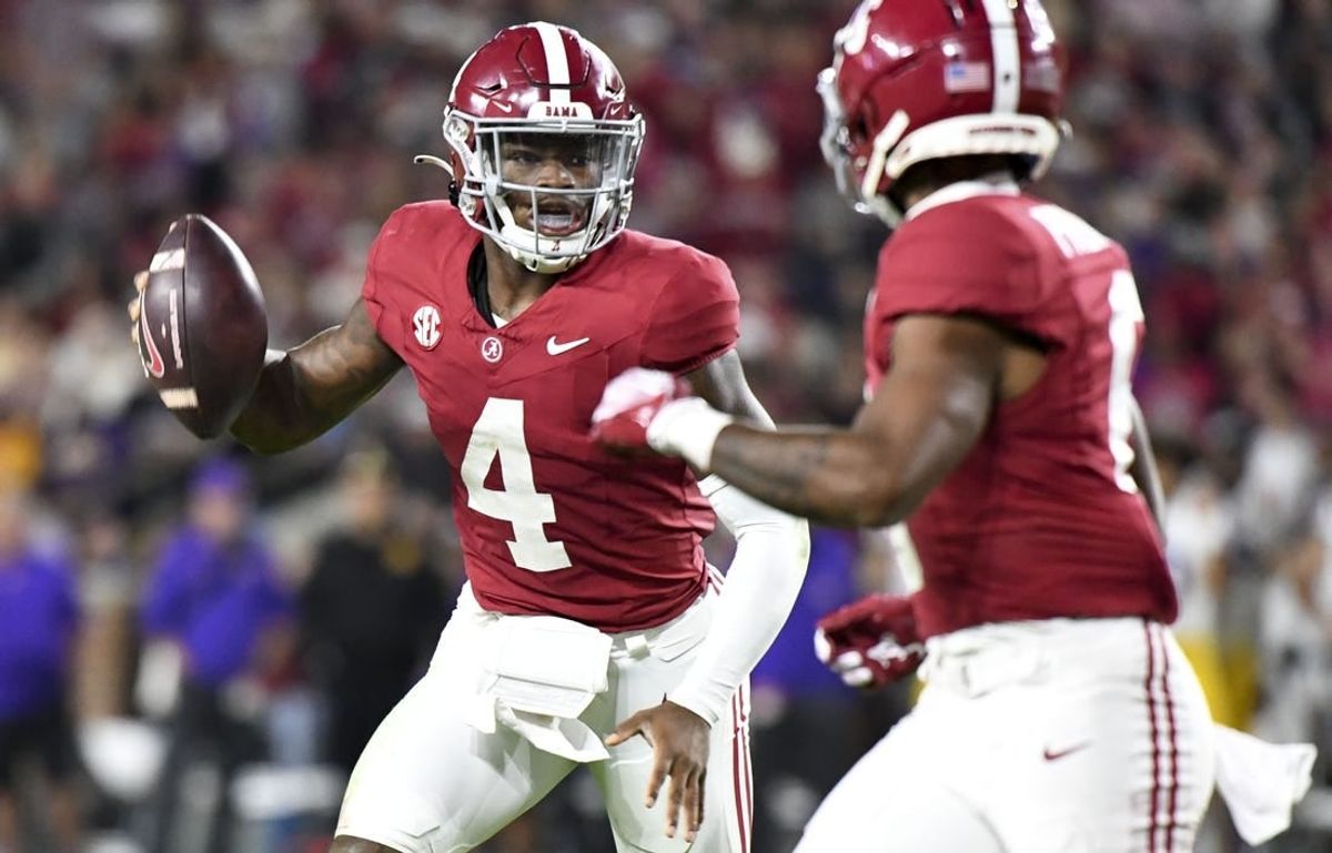 Nov 4, 2023; Tuscaloosa, Alabama, USA;  Alabama Crimson Tide quarterback Jalen Milroe (4) runs for a touchdown against LSU at Bryant-Denny Stadium. Alabama defeated LSU 42-28.