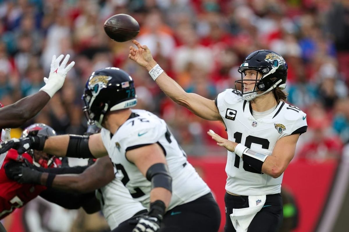 Dec 24, 2023; Tampa, Florida, USA;  Jacksonville Jaguars quarterback Trevor Lawrence (16) drops back to pass against the Tampa Bay Buccaneers in the second quarter at Raymond James Stadium.