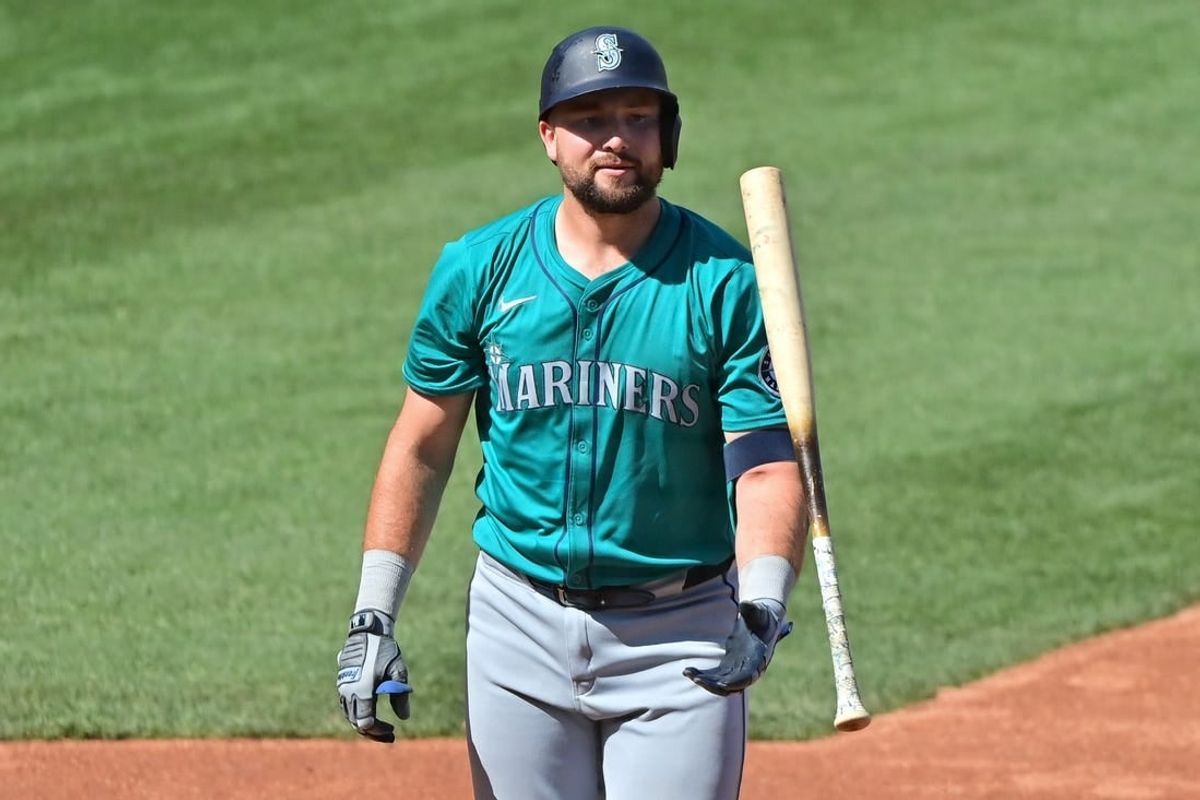 Mar 8, 2024; Mesa, Arizona, USA;  Seattle Mariners catcher Cal Raleigh (29) reacts after striking out in the second inning against the Chicago Cubs during a spring training game at Sloan Park.