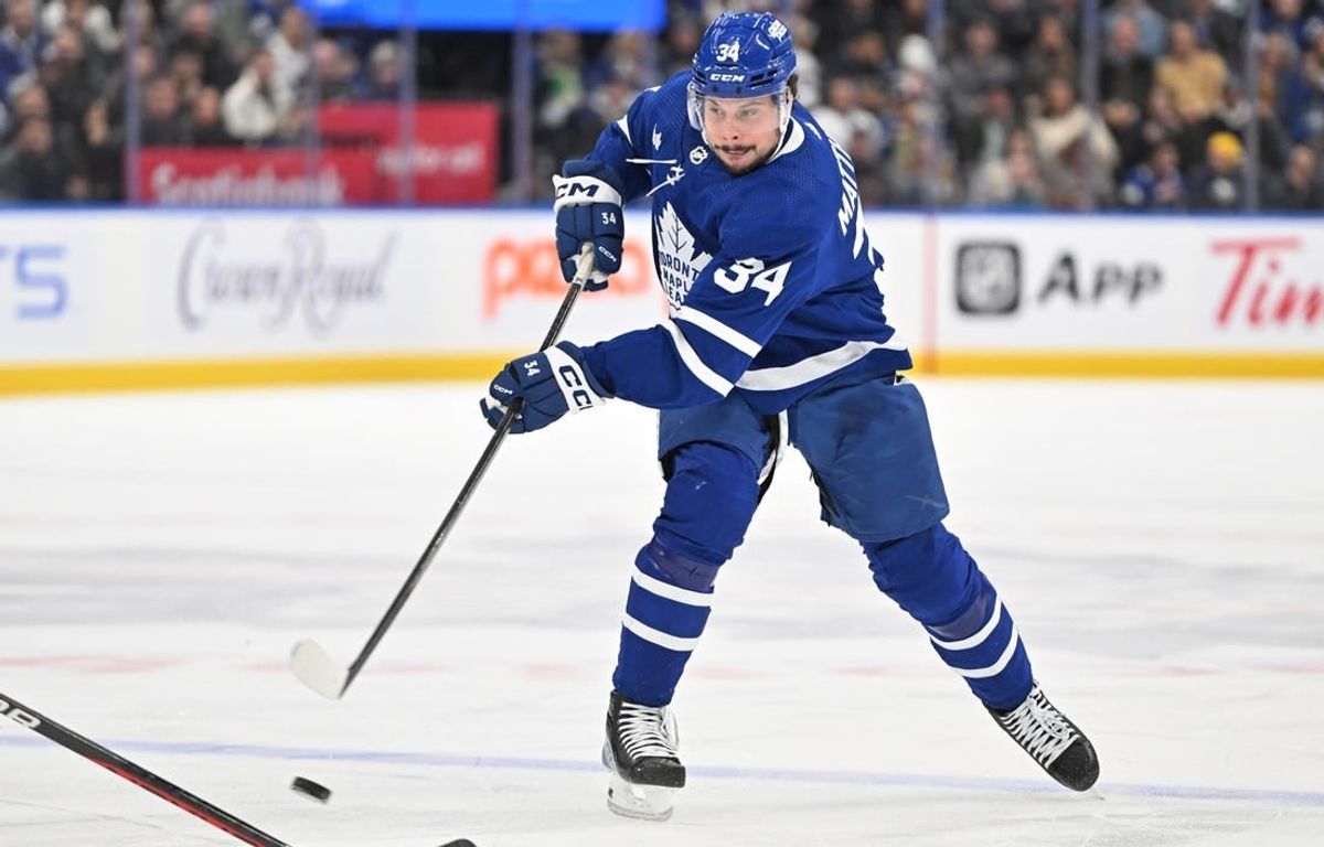 Dec 30, 2023; Toronto, Ontario, CAN; Toronto Maple Leafs forward Auston Matthews (34) shoots the puck against the Carolina Hurricanes in the first period at Scotiabank Arena.