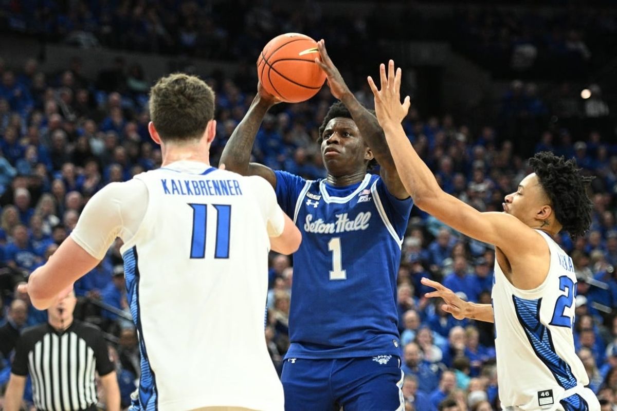 Feb 28, 2024; Omaha, Nebraska, USA; Seton Hall Pirates guard Kadary Richmond (1) shoots over Creighton Bluejays center Ryan Kalkbrenner (11) and guard Trey Alexander (23) in the first half at CHI Health Center Omaha.