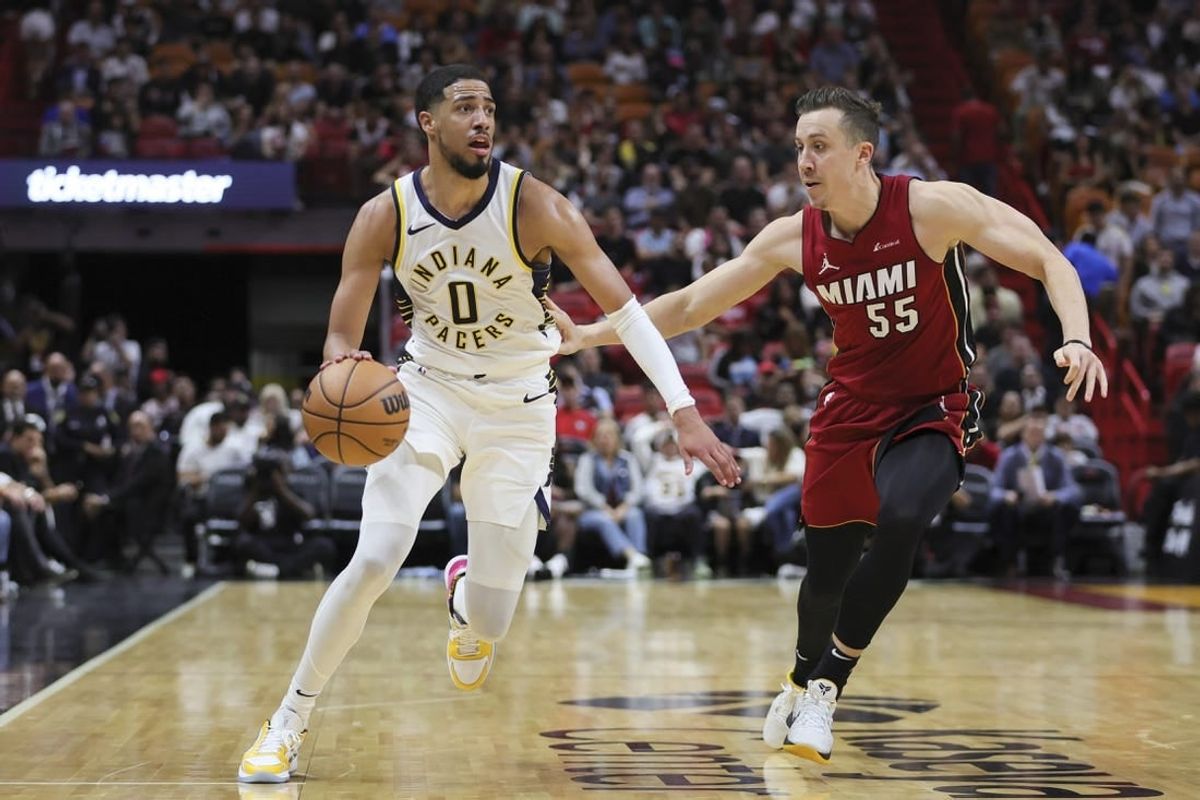 Nov 30, 2023; Miami, Florida, USA; Indiana Pacers guard Tyrese Haliburton (0) drives to the basket against Miami Heat forward Duncan Robinson (55) during the second quarter at Kaseya Center.