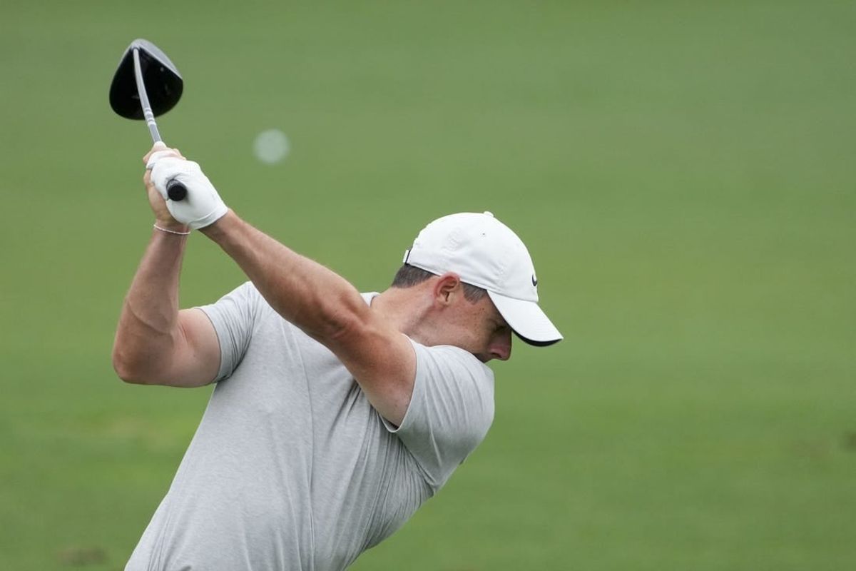 Apr 9, 2024; Augusta, Georgia, USA; Rory McIlroy hits balls at the driving range during a practice round for the Masters Tournament golf tournament at Augusta National Golf Club.