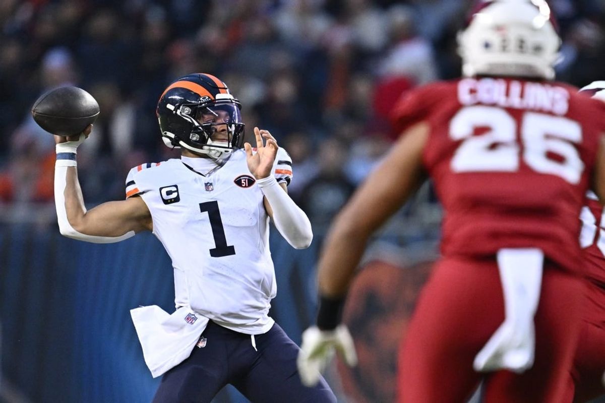 Dec 24, 2023; Chicago, Illinois, USA;  Chicago Bears quarterback Justin Fields (1) passes in the first half against the Arizona Cardinals at Soldier Field.