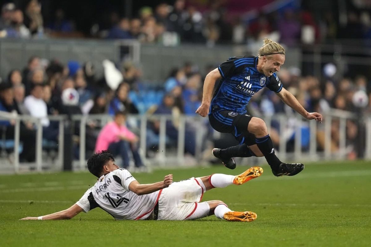 May 27, 2023; San Jose, California, USA; San Jose Earthquakes forward Tommy Thompson (right) leaps after a tackle by FC Dallas defender Marco Farfan (4) during the second half at PayPal Park.