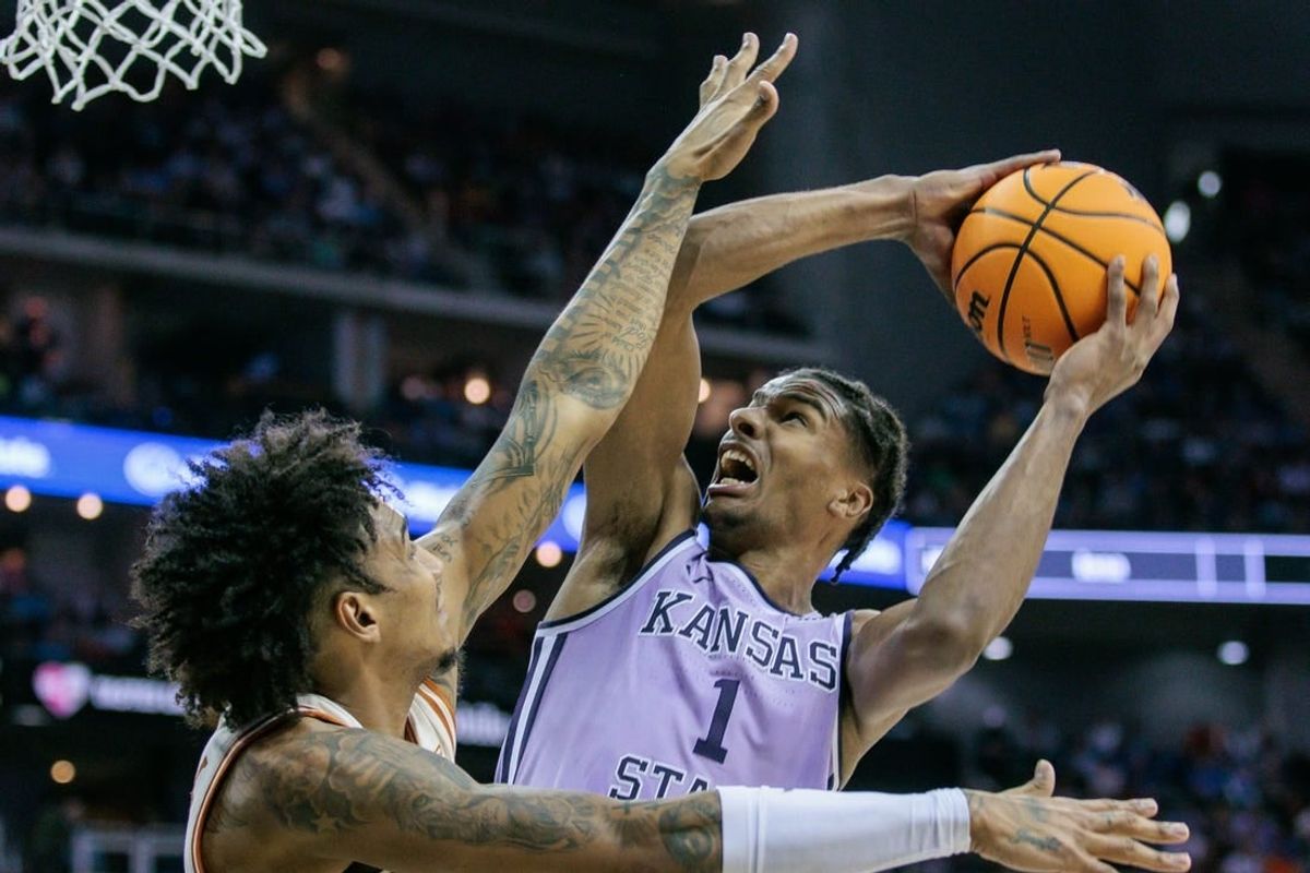 Mar 13, 2024; Kansas City, MO, USA; Kansas State Wildcats forward David N'Guessan (1) shoots the ball during the second half against the Texas Longhorns at T-Mobile Center.