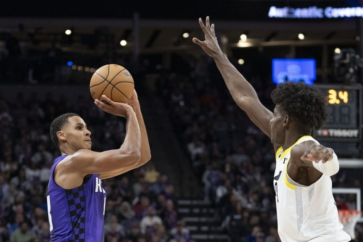 December 16, 2023; Sacramento, California, USA; Sacramento Kings forward Keegan Murray (13) shoots the basketball against Utah Jazz forward Taylor Hendricks (0) during the third quarter at Golden 1 Center.