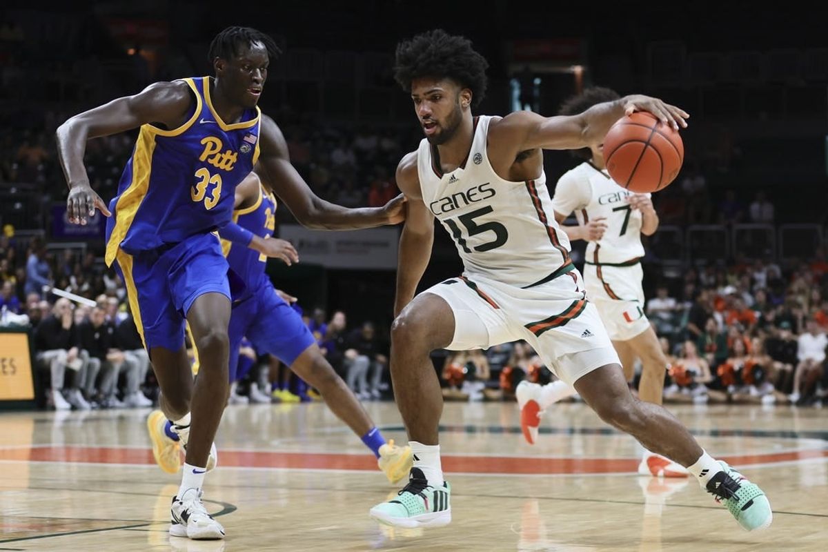 Jan 27, 2024; Coral Gables, Florida, USA; Miami Hurricanes forward Norchad Omier (15) drives to the basket against Pittsburgh Panthers center Federiko Federiko (33) during the second half at Watsco Center.