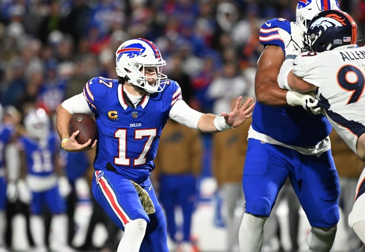 Nov 13, 2023; Orchard Park, New York, USA; Buffalo Bills quarterback Josh Allen (17) runs the ball against the Denver Broncos in the third quarter at Highmark Stadium.