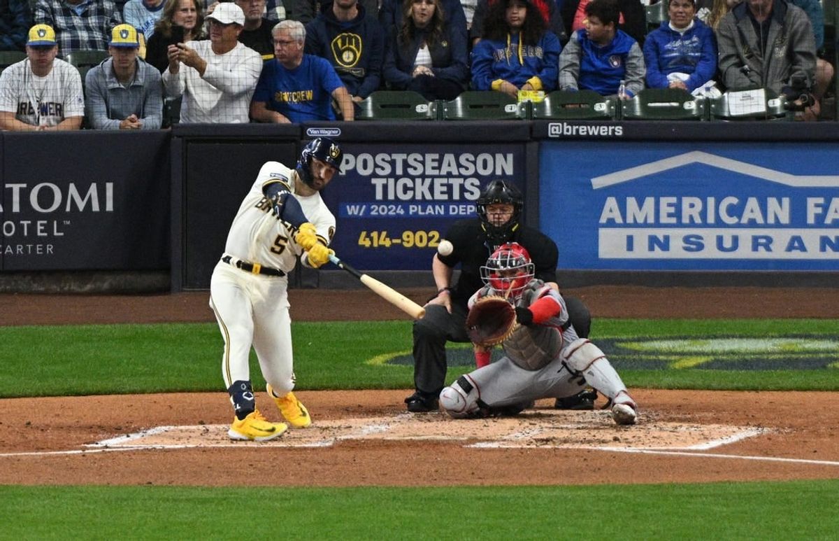 Sep 28, 2023; Milwaukee, Wisconsin, USA; Milwaukee Brewers outfielder Garrett Mitchell (5) hits a double against the St. Louis Cardinals in the fourth inning at American Family Field.