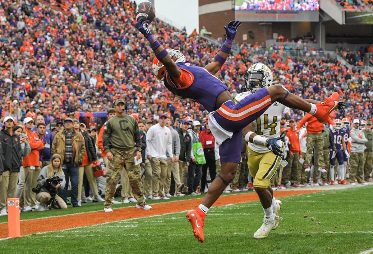 Nov 11, 2023; Clemson, South Carolina, USA; Clemson Tigers receiver Tyler Brown (6) catches a pass for a touchdown against Georgia Tech Yellow Jackets defensive back Jayloh King (14) during the second quarter  at Memorial Stadium.