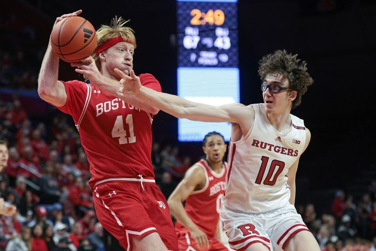Nov 10, 2023; Piscataway, New Jersey, USA; Boston University Terriers forward Otto Landrum (41) grabs the ball in front of Rutgers Scarlet Knights guard Gavin Griffiths (10) during the second half at Jersey Mike's Arena.