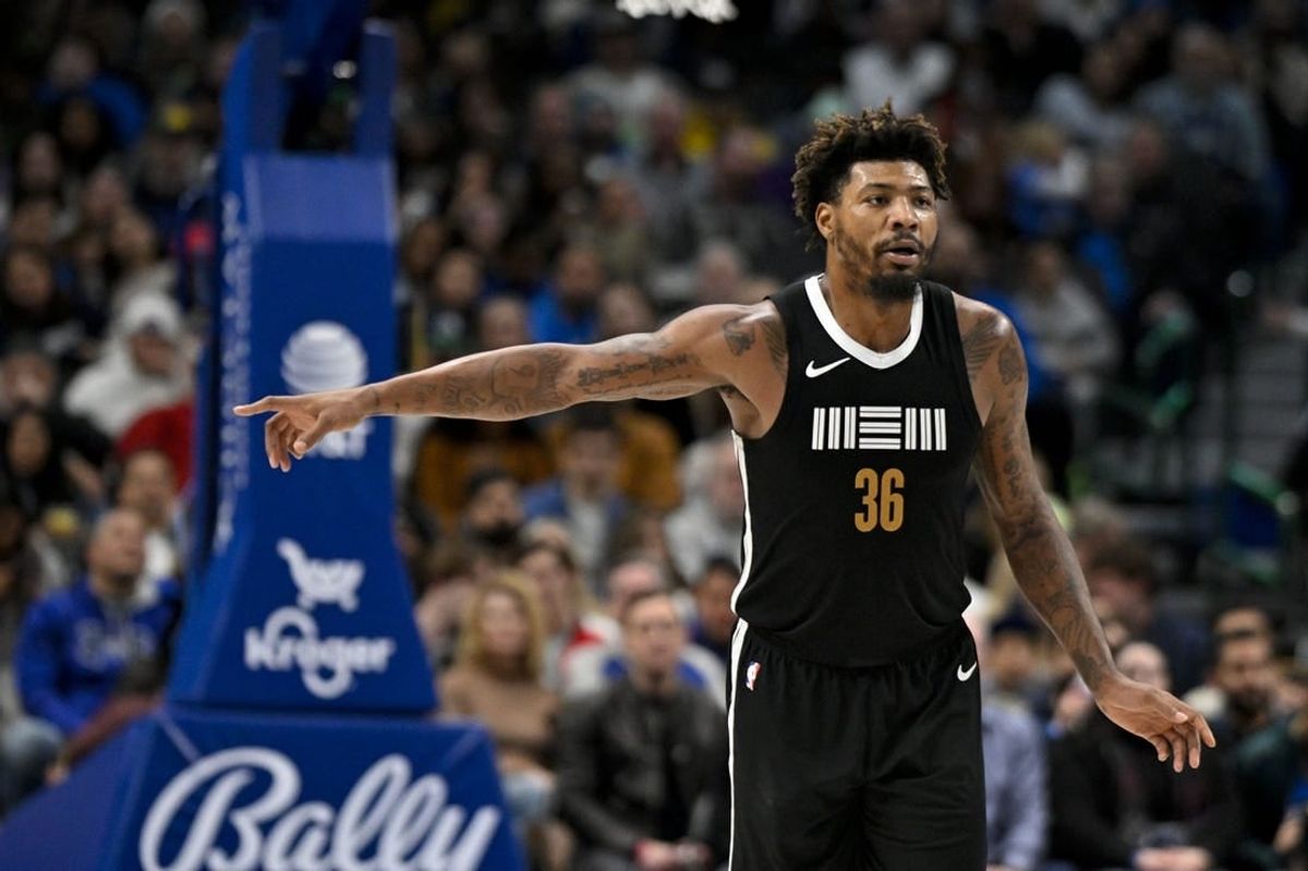 Jan 9, 2024; Dallas, Texas, USA; Memphis Grizzlies guard Marcus Smart (36) celebrates after he makes a three point shot against the Dallas Mavericks during the second half at the American Airlines Center.