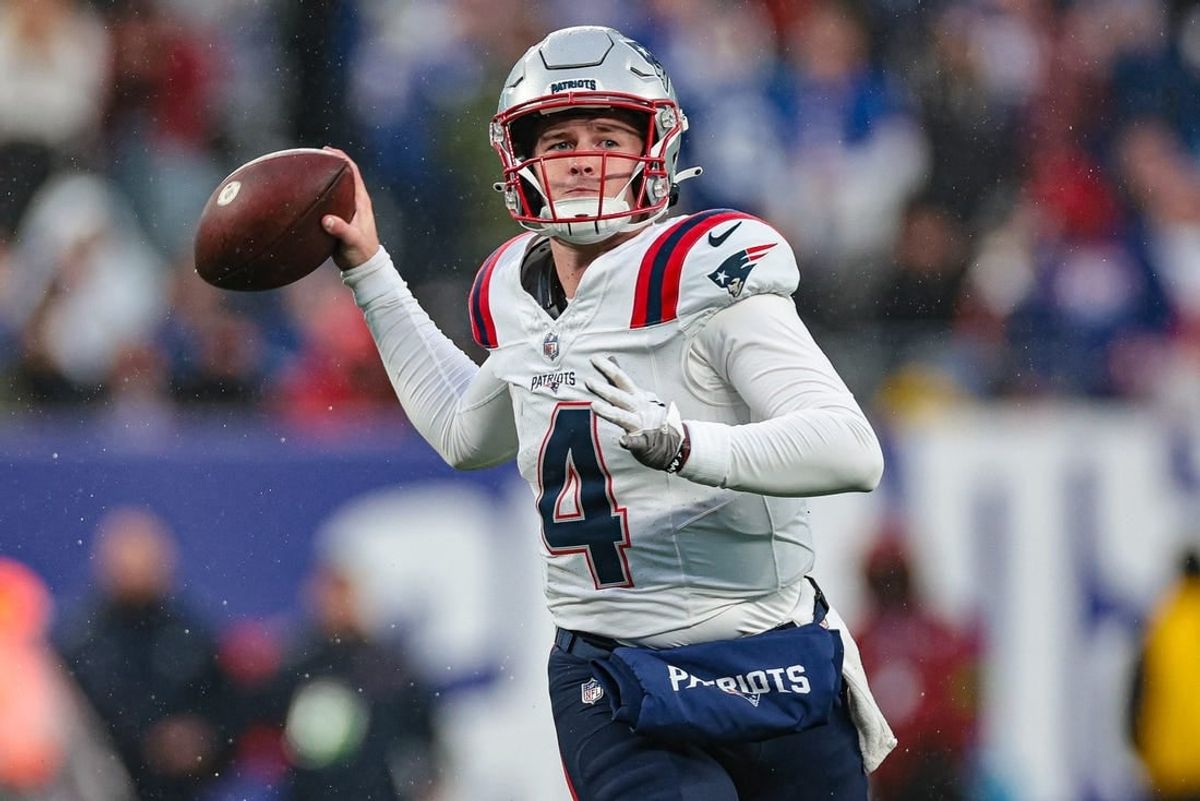 Nov 26, 2023; East Rutherford, New Jersey, USA; New England Patriots quarterback Bailey Zappe (4) throws the ball during the second half against the New York Giants at MetLife Stadium.