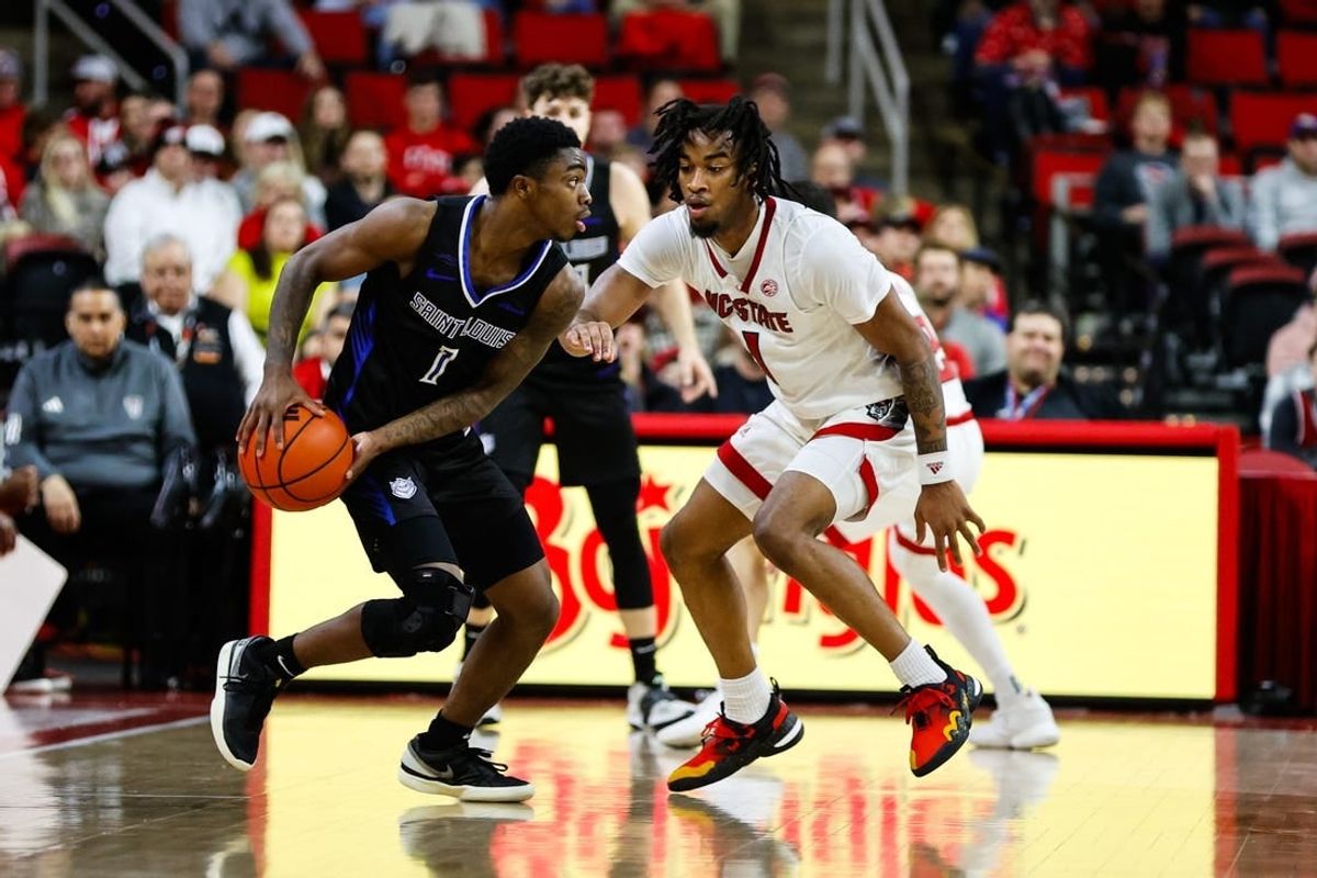 Dec 20, 2023; Raleigh, North Carolina, USA; Saint Louis Billikens guard Cian Medley (1) dribbles with the ball during the first half against North Carolina State Wolfpack at PNC Arena.