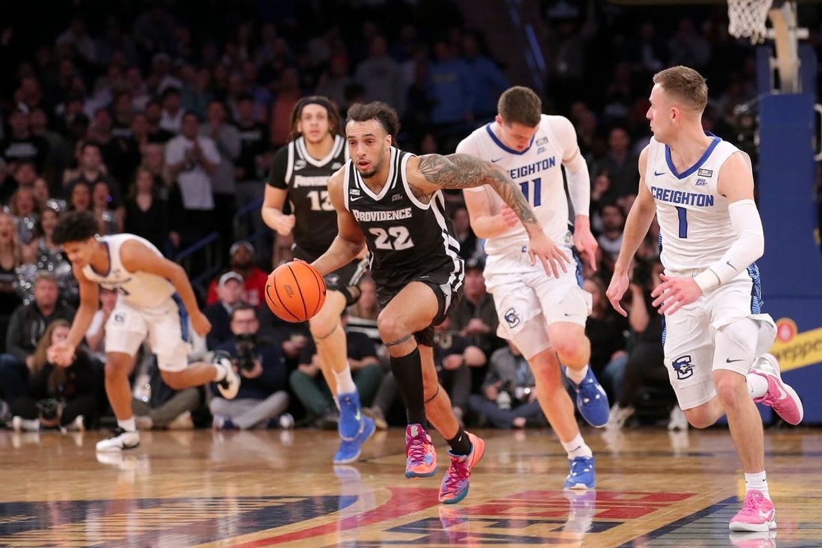 Mar 14, 2024; New York City, NY, USA; Providence Friars guard Devin Carter (22) brings the ball up court against Creighton Bluejays center Ryan Kalkbrenner (11) and guard Steven Ashworth (1) during the first half at Madison Square Garden.
