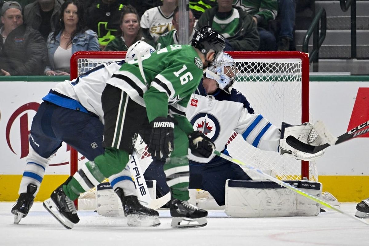 Feb 29, 2024; Dallas, Texas, USA; Dallas Stars center Joe Pavelski (16) scores a goal past Winnipeg Jets goaltender Connor Hellebuyck (37) during the first period at the American Airlines Center.