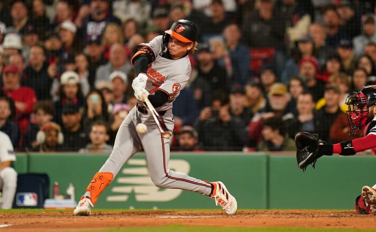 Apr 10, 2024; Boston, Massachusetts, USA; Baltimore Orioles second base Jackson Holliday (7) gets his first major league base hit against the Boston Red Sox in the fifth inning at Fenway Park.