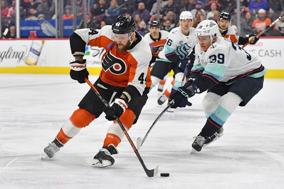 Feb 10, 2024; Philadelphia, Pennsylvania, USA; Philadelphia Flyers left wing Nicolas Deslauriers (44) is defended by Seattle Kraken defenseman Ryker Evans (39) during the first period at Wells Fargo Center.