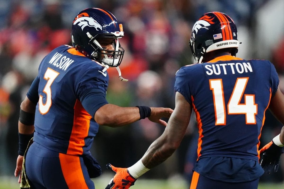 Nov 19, 2023; Denver, Colorado, USA; Denver Broncos quarterback Russell Wilson (3) and wide receiver Courtland Sutton (14) before the game at Empower Field at Mile High.