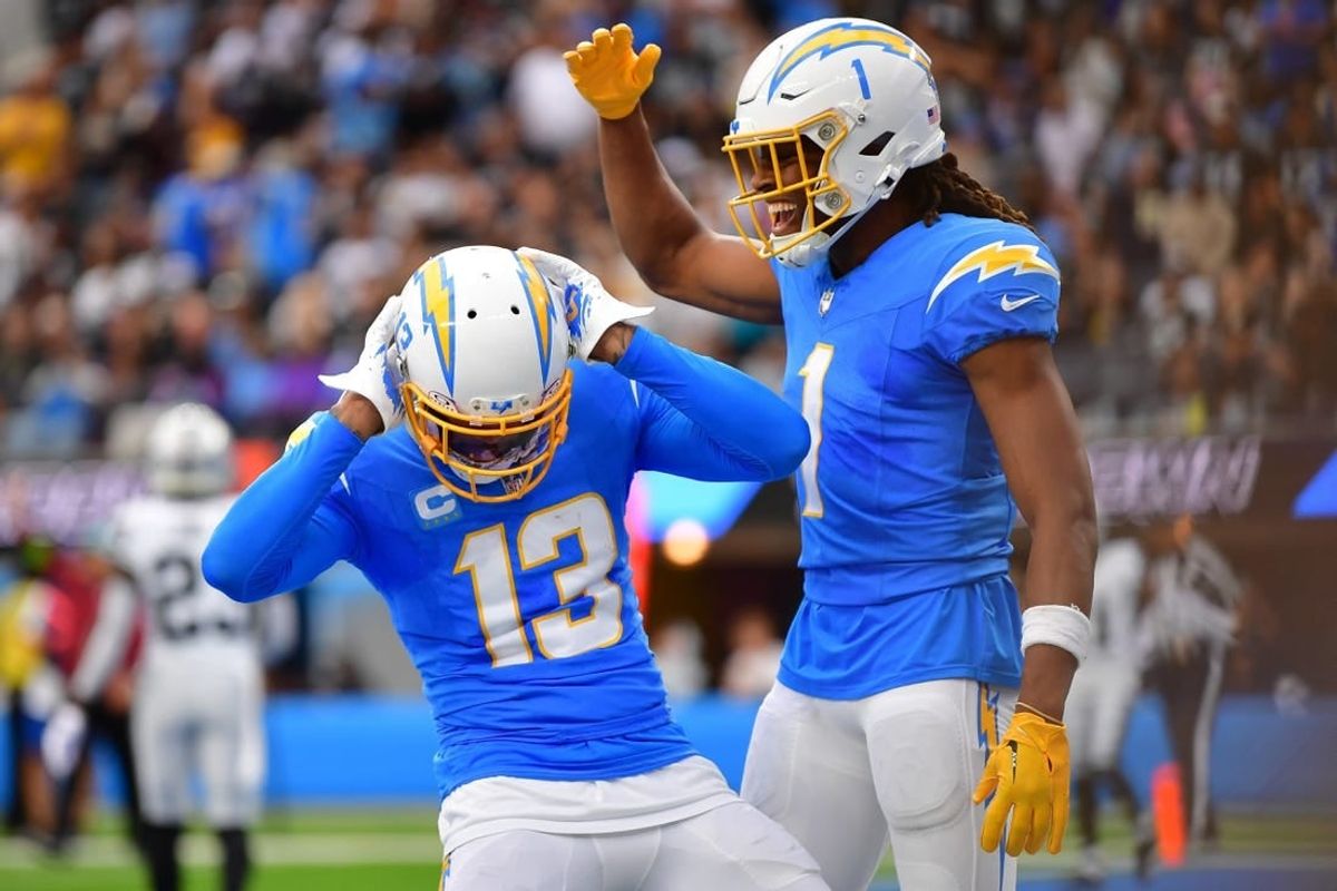 Oct 1, 2023; Inglewood, California, USA; Los Angeles Chargers wide receiver Keenan Allen (13) celebrates his touchdown scored against the Las Vegas Raiders with wide receiver Quentin Johnston (1) during the first half at SoFi Stadium.