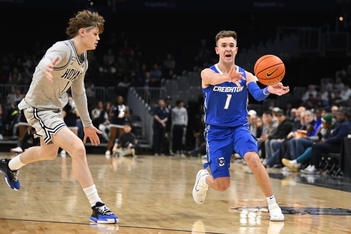 Jan 2, 2024; Washington, District of Columbia, USA; Creighton Bluejays guard Steven Ashworth (1) passes the ball as Georgetown Hoyas guard Rowan Brumbaugh (1) looks on during the first half at Capital One Arena.
